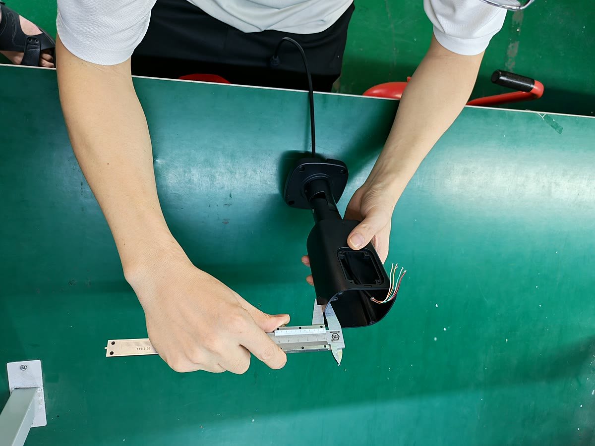 ENSTER CCTV camera housing incoming-material inspection with caliper